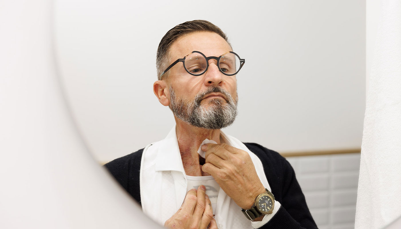 Man cleaning stoma maintenance